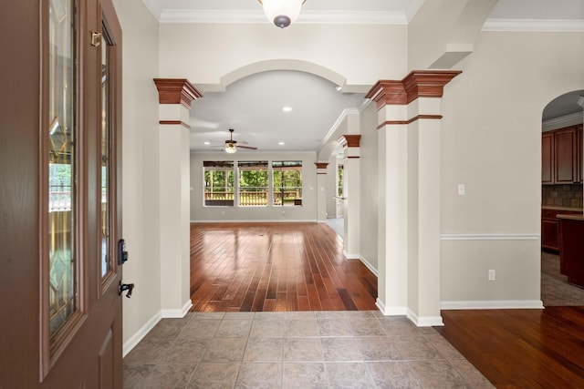 10 Hollow Glen Ln, Tomball, TX 77375 - foyer with arched walkways, a ceiling fan, crown molding, hardwood / wood-style floors, and ornate columns
