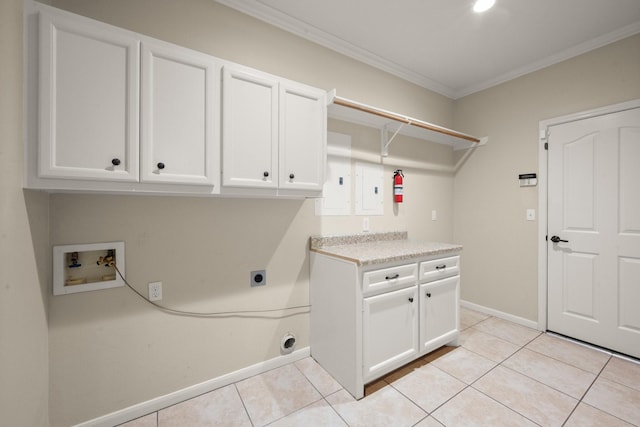 10 Hollow Glen Ln, Tomball, TX 77375 - washroom with electric dryer hookup, cabinet space, washer hookup, ornamental molding, and light tile patterned floors