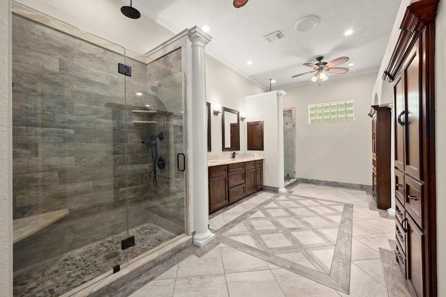 10 Hollow Glen Ln, Tomball, TX 77375 - bathroom with ornamental molding, ceiling fan, vanity, a stall shower, and baseboards