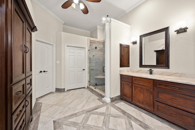 10 Hollow Glen Ln, Tomball, TX 77375 - bathroom with a shower stall, vanity, a ceiling fan, ornamental molding, and decorative columns