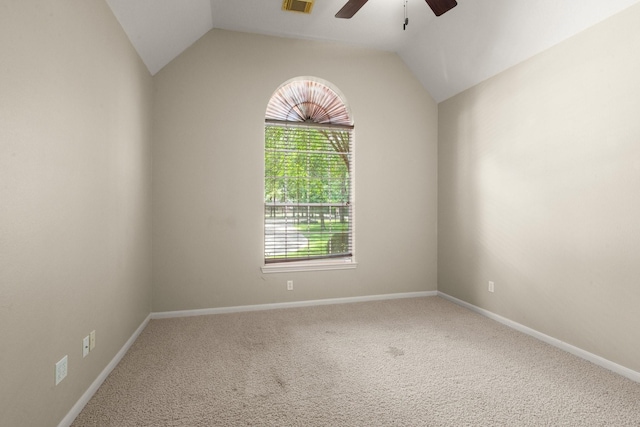 10 Hollow Glen Ln, Tomball, TX 77375 - empty room with a ceiling fan, healthy amount of natural light, carpet floors, lofted ceiling, and baseboards