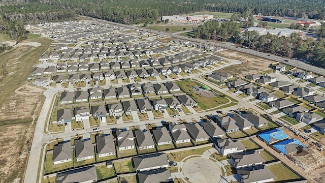 14827 Crimson Peak Ln, Splendora, TX 77372 - aerial overview of property's location with a forest and nearby suburban area