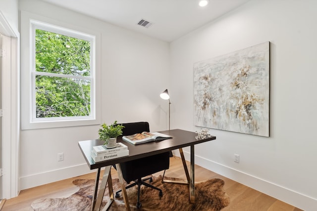 office space with baseboards, wood finished floors, and recessed lighting
