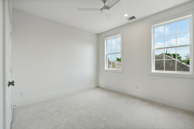 carpeted spare room with ceiling fan, baseboards, and recessed lighting