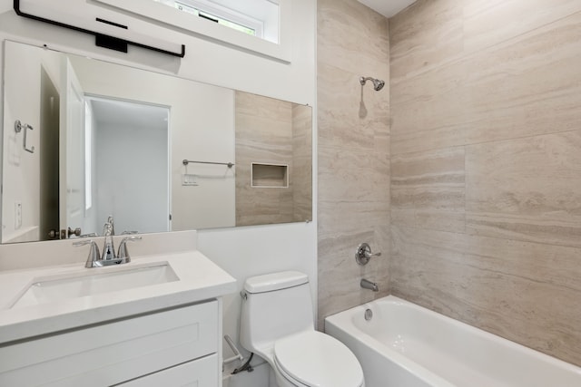 bathroom featuring shower / bath combination, toilet, and vanity