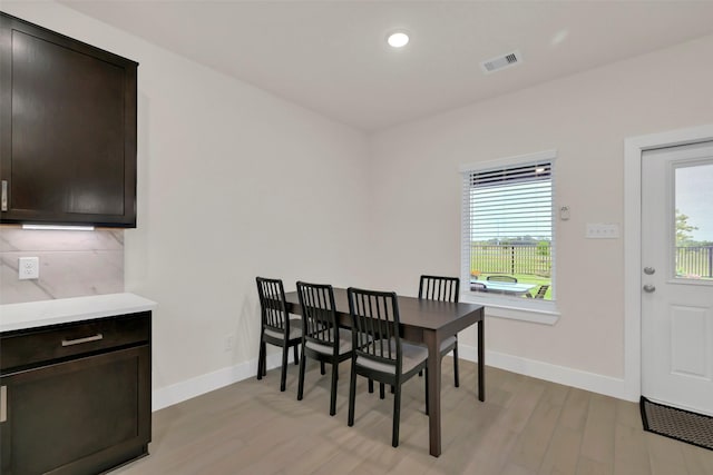 2108 Eagle Nook Dr, Texas City, TX 77568 - dining space featuring light wood-style flooring, plenty of natural light, baseboards, and recessed lighting