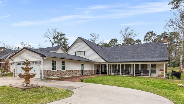42 Cherry Hill Dr, Conroe, TX 77304 - view of front of house with a front lawn, driveway, a garage, a porch, and a chimney
