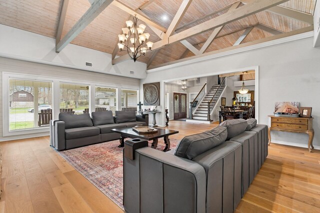 42 Cherry Hill Dr, Conroe, TX 77304 - living area featuring stairs, wood ceiling with exposed beams, a chandelier, light wood-style flooring, and high vaulted ceiling