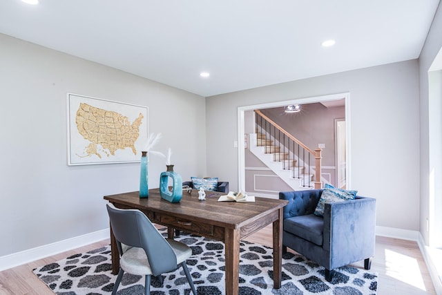 office space with wood finished floors, baseboards, and recessed lighting
