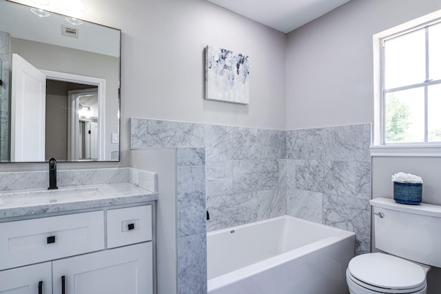 full bath with toilet, a bath, and vanity