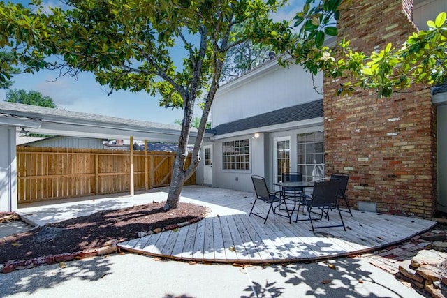 deck featuring fence and outdoor dining space