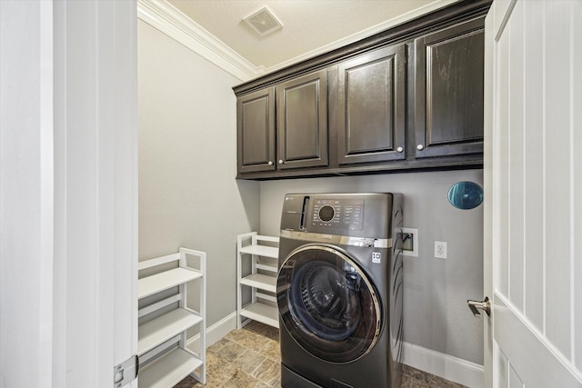 clothes washing area with washer / clothes dryer, cabinet space, baseboards, and crown molding