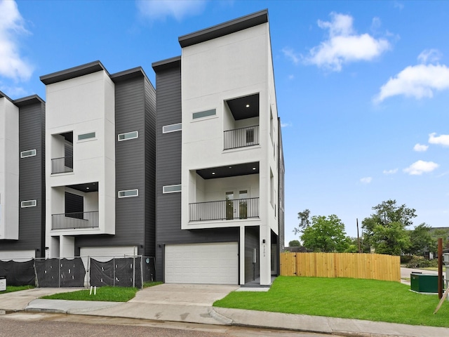 1264 Finnigan St, Houston, TX 77020 - contemporary home featuring an attached garage, a balcony, and concrete driveway