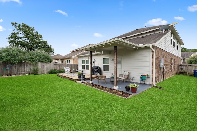 18910 S Sapling Oaks Pl, Magnolia, TX 77355 - back of property featuring a patio and brick siding
