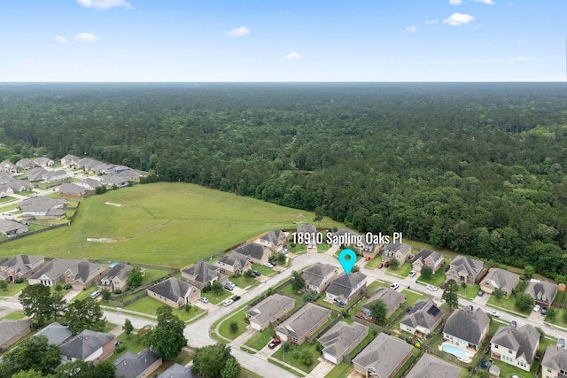 18910 S Sapling Oaks Pl, Magnolia, TX 77355 - aerial view of property's location with a heavily wooded area and nearby suburban area