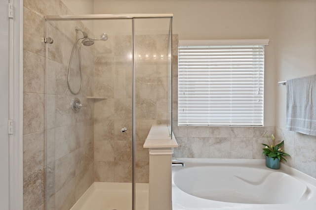 18910 S Sapling Oaks Pl, Magnolia, TX 77355 - full bathroom featuring a shower stall and a bath