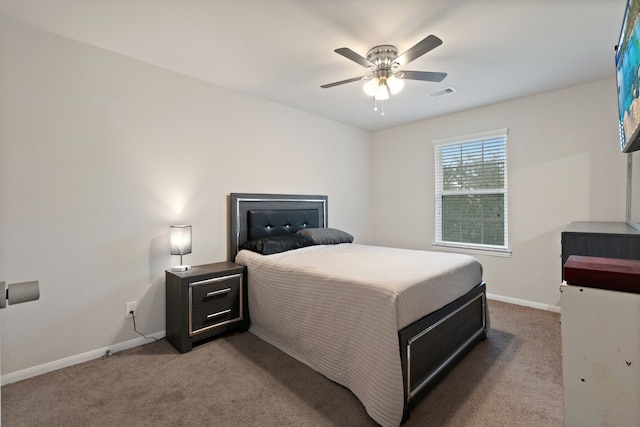 18910 S Sapling Oaks Pl, Magnolia, TX 77355 - bedroom with carpet floors, baseboards, and ceiling fan