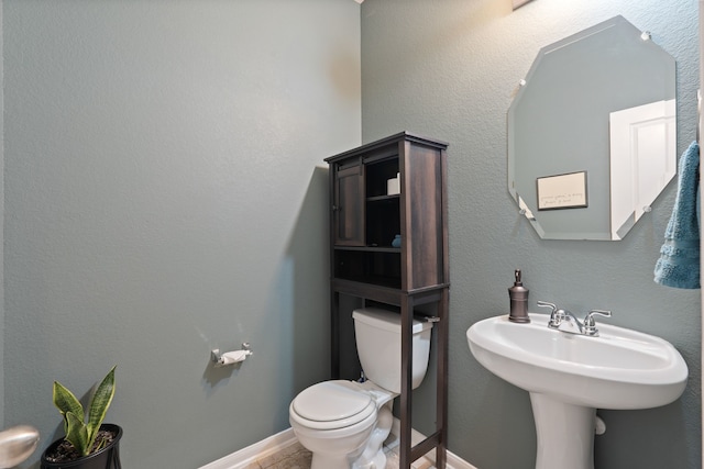 18910 S Sapling Oaks Pl, Magnolia, TX 77355 - half bathroom featuring toilet and a sink