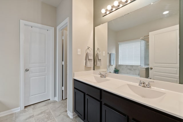 18910 S Sapling Oaks Pl, Magnolia, TX 77355 - bathroom featuring baseboards and double vanity