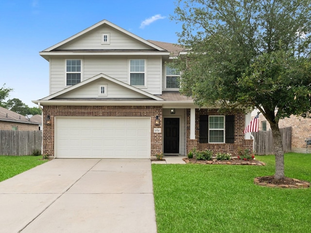 18910 S Sapling Oaks Pl, Magnolia, TX 77355 - view of front of home featuring brick siding, a garage, driveway, and covered porch
