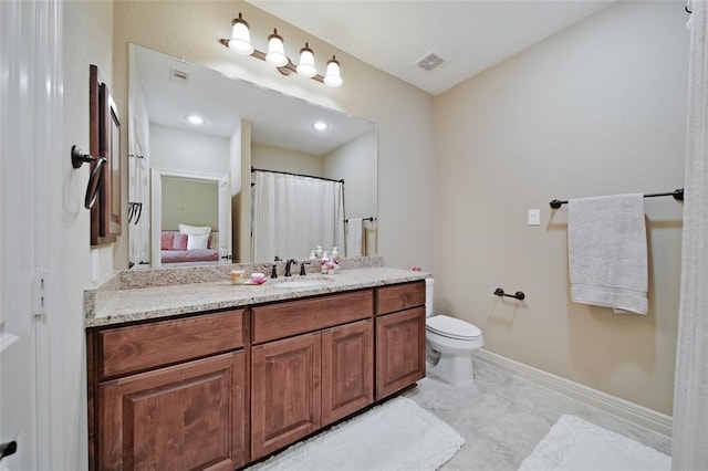 14710 Turquoise Ct, Willis, TX 77378 - bathroom with vanity, toilet, and baseboards