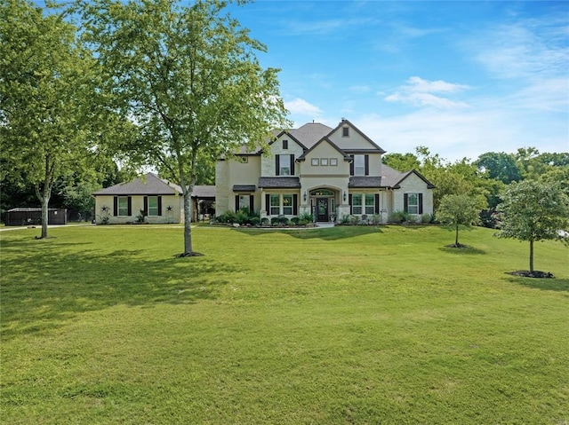 14710 Turquoise Ct, Willis, TX 77378 - view of front of property featuring a front yard and stucco siding