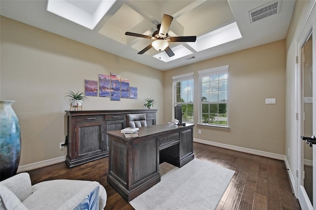 14710 Turquoise Ct, Willis, TX 77378 - home office featuring a ceiling fan, baseboards, a skylight, and dark wood-style flooring