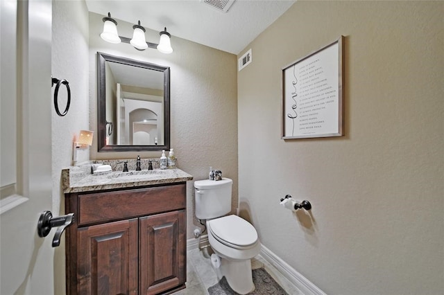 14710 Turquoise Ct, Willis, TX 77378 - half bathroom featuring toilet, vanity, baseboards, and tile patterned flooring