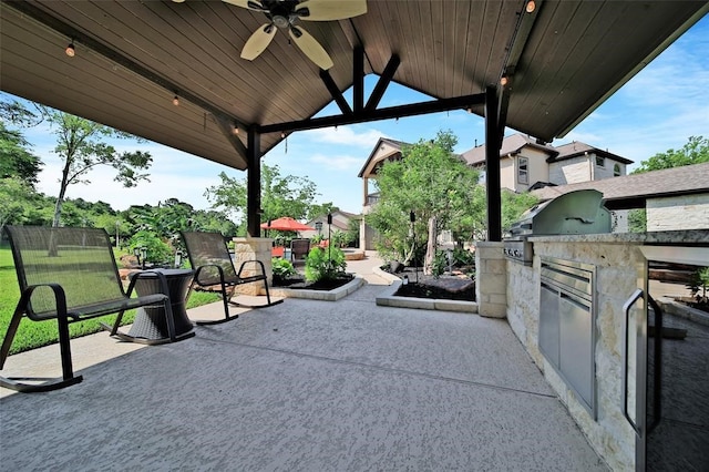 14710 Turquoise Ct, Willis, TX 77378 - view of patio featuring a ceiling fan, exterior kitchen, and a grill