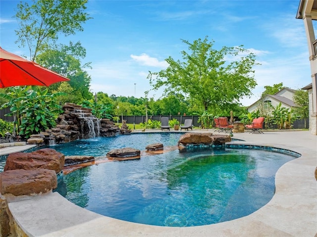 14710 Turquoise Ct, Willis, TX 77378 - view of swimming pool featuring fence and a patio area
