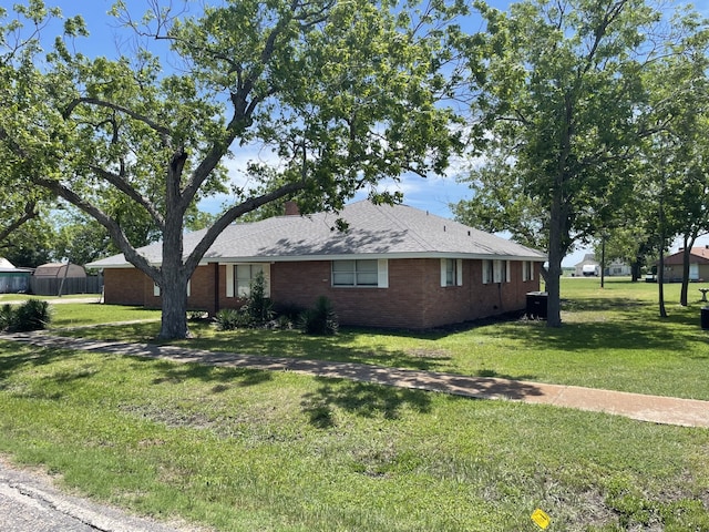 441 E Clark St, Bartlett, TX 76511 - view of front of property with a front yard and brick siding