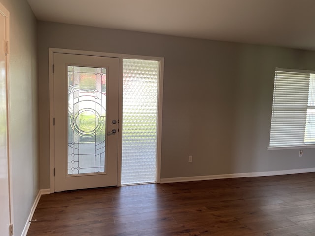 441 E Clark St, Bartlett, TX 76511 - foyer entrance featuring dark wood-type flooring and baseboards