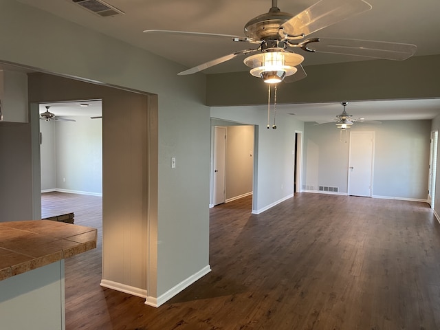 441 E Clark St, Bartlett, TX 76511 - unfurnished room with a ceiling fan, dark wood-style floors, and baseboards