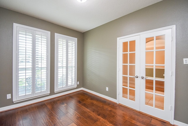8502 Calverton Pines Ln, Houston, TX 77095 - spare room with french doors, plenty of natural light, dark wood-type flooring, and baseboards