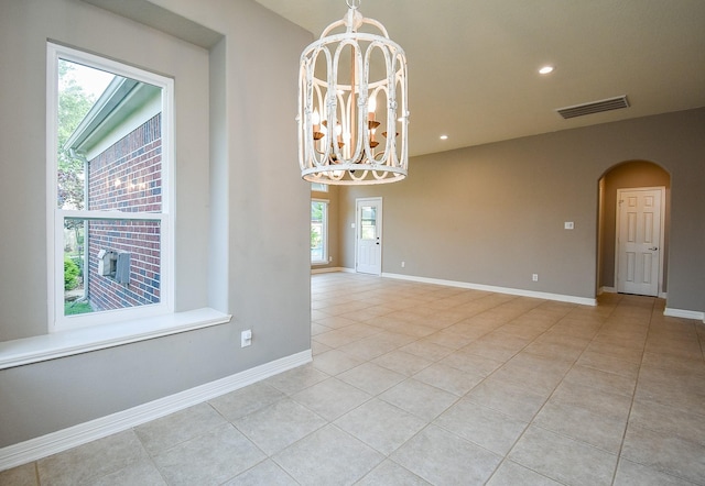 8502 Calverton Pines Ln, Houston, TX 77095 - unfurnished room featuring light tile patterned flooring, arched walkways, a chandelier, baseboards, and recessed lighting