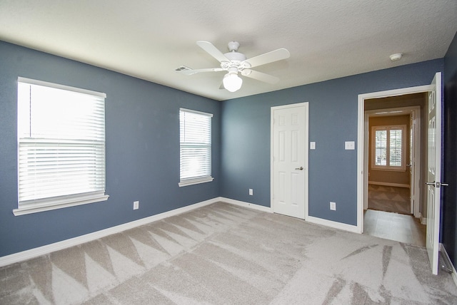 8502 Calverton Pines Ln, Houston, TX 77095 - unfurnished bedroom with carpet, baseboards, and ceiling fan