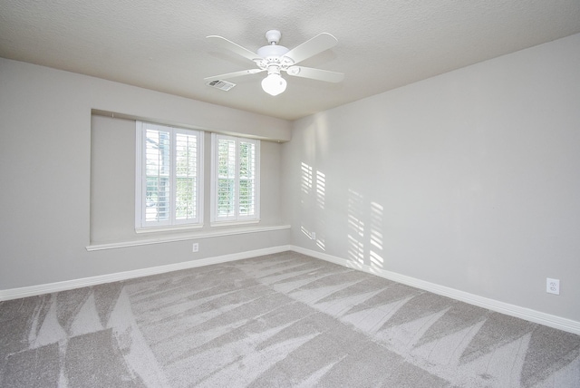 8502 Calverton Pines Ln, Houston, TX 77095 - empty room featuring carpet flooring, baseboards, ceiling fan, and a textured ceiling