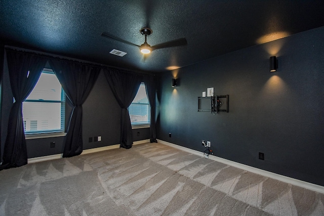 8502 Calverton Pines Ln, Houston, TX 77095 - carpeted spare room with ceiling fan, a textured ceiling, and baseboards