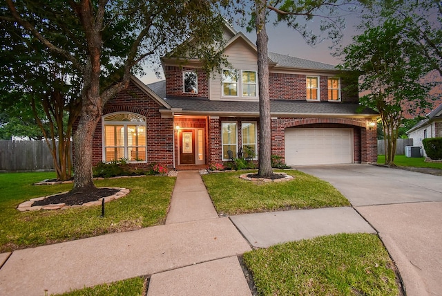 8502 Calverton Pines Ln, Houston, TX 77095 - traditional-style house featuring brick siding, central AC unit, concrete driveway, a garage, and a shingled roof