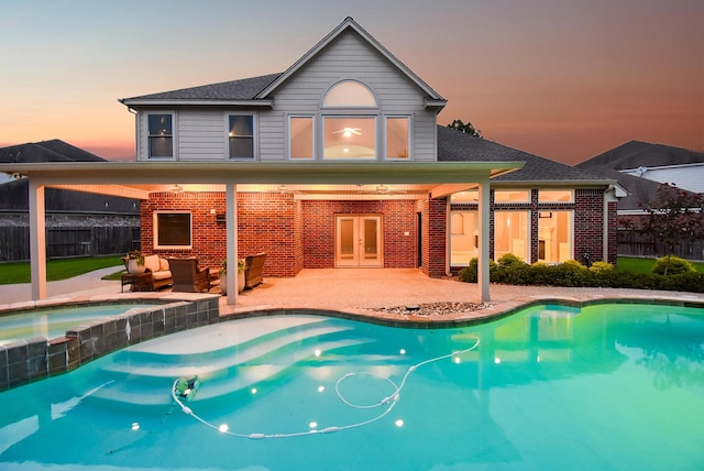 8502 Calverton Pines Ln, Houston, TX 77095 - rear view of property with french doors, brick siding, and a patio area