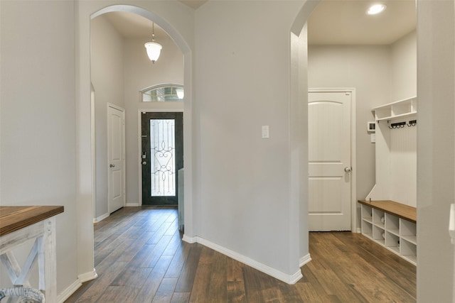 2514 Copper Fields Dr, Rosharon, TX 77583 - foyer entrance with dark wood-type flooring, baseboards, and arched walkways