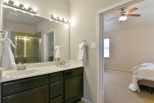 2514 Copper Fields Dr, Rosharon, TX 77583 - bathroom with a shower stall, a ceiling fan, double vanity, and a sink