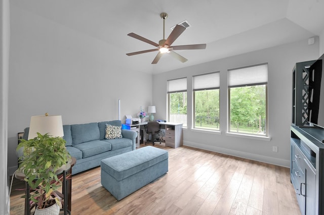 living area with a ceiling fan, baseboards, a desk, and light wood-type flooring