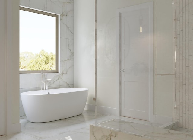 1039 Alexander St, Houston, TX 77008 - bathroom with marble tiled floors and a freestanding bath