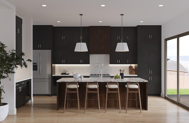 1039 Alexander St, Houston, TX 77008 - kitchen with high quality fridge, dark cabinets, tasteful backsplash, and recessed lighting