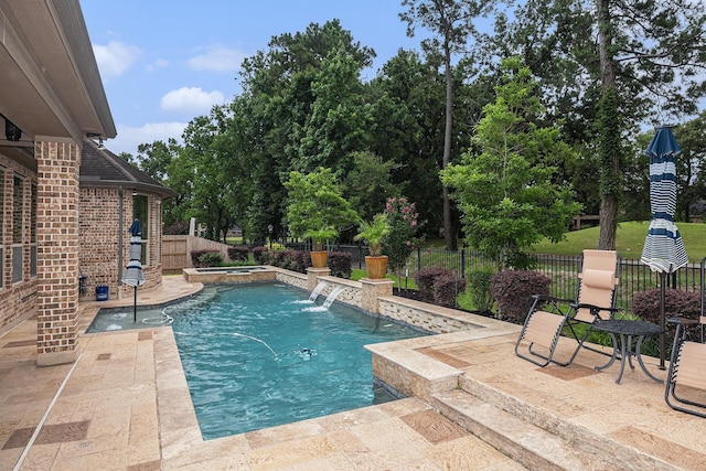 view of pool featuring a fenced backyard, a patio, and a pool with connected hot tub