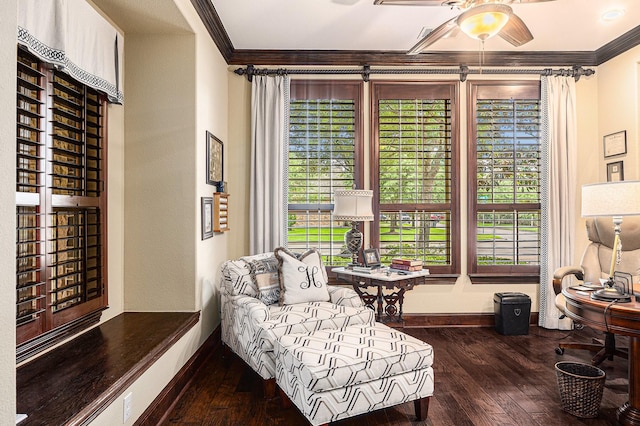 sitting room with crown molding, plenty of natural light, wood-type flooring, ceiling fan, and baseboards