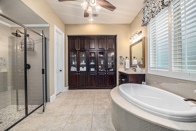 full bath with a shower stall, a garden tub, ceiling fan, vanity, and tile patterned flooring