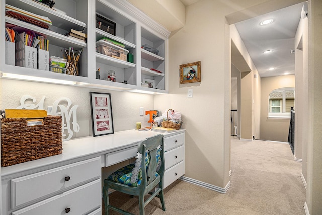 home office with built in study area, light colored carpet, recessed lighting, and baseboards