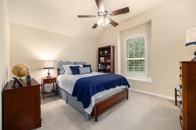 bedroom with light carpet, baseboards, a ceiling fan, and lofted ceiling